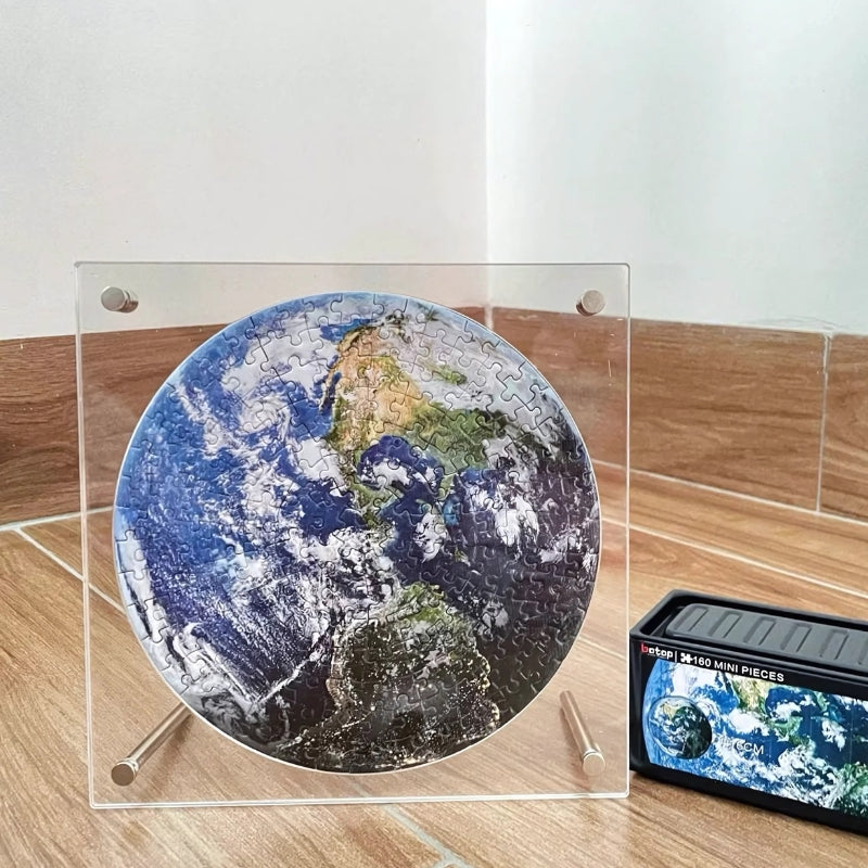 Round Earth puzzle framed in acrylic, displaying a satellite view of the Americas.