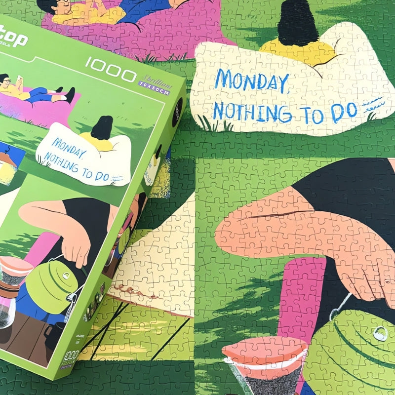 Completed Camping Diary puzzle with box showing lazy day illustrations including coffee, cat, and lounging