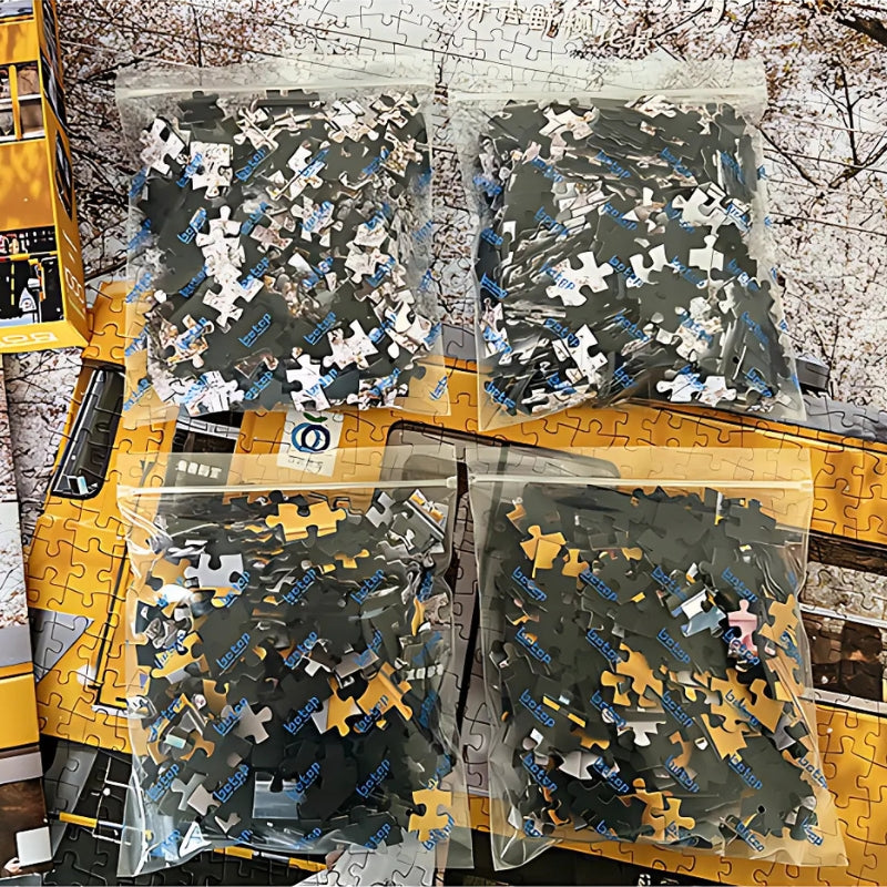 Four sealed bags of puzzle pieces laid out over the sakura train puzzle artwork