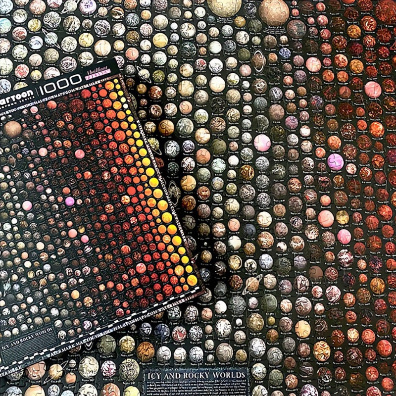 Completed Universe puzzle with box placed over detailed grid of rocky and icy planets