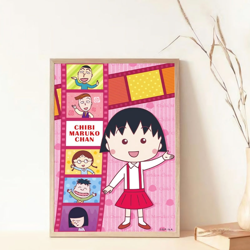 Framed Botop Chibi Maruko-chan puzzle with pink filmstrip background and cartoon characters.