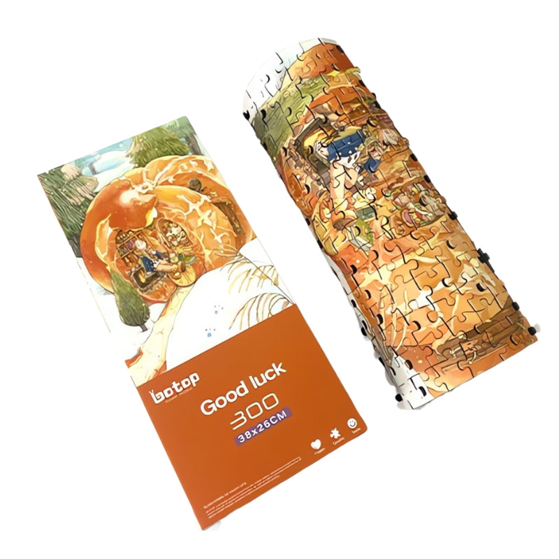 Rolled Good Luck puzzle beside its orange box and artwork card, showing storage view