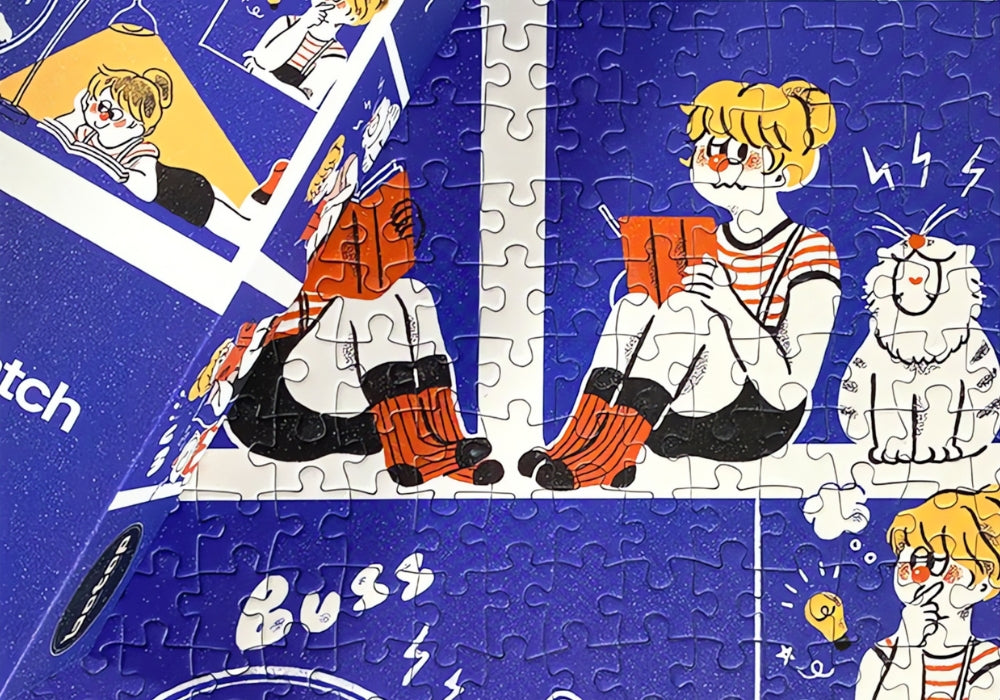 Close-up of assembled puzzle showing girl reading a book beside a cat and hamster in a wheel.