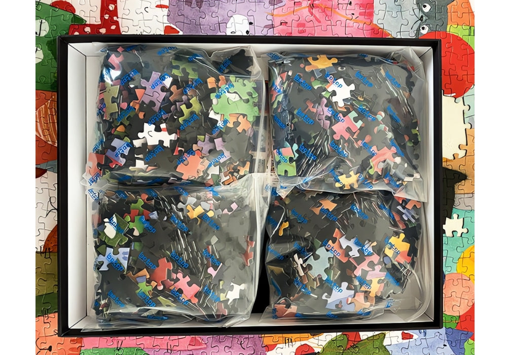 Botop Cats puzzle box opened showing sorted pieces in sealed bags