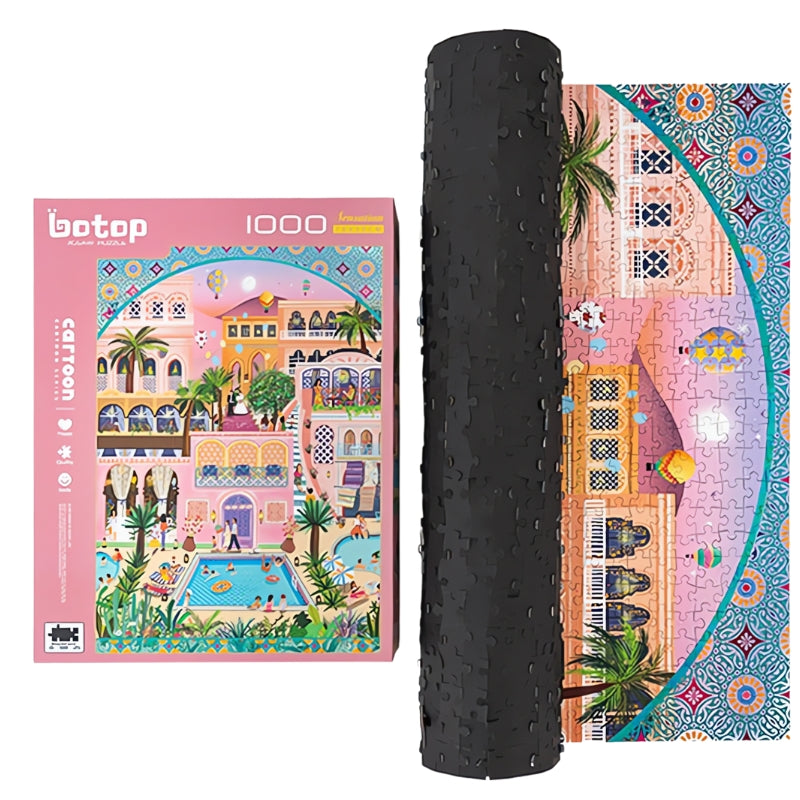 Completed puzzle next to its box, showing vivid details of a whimsical resort scene with lush plants and bright tiles.