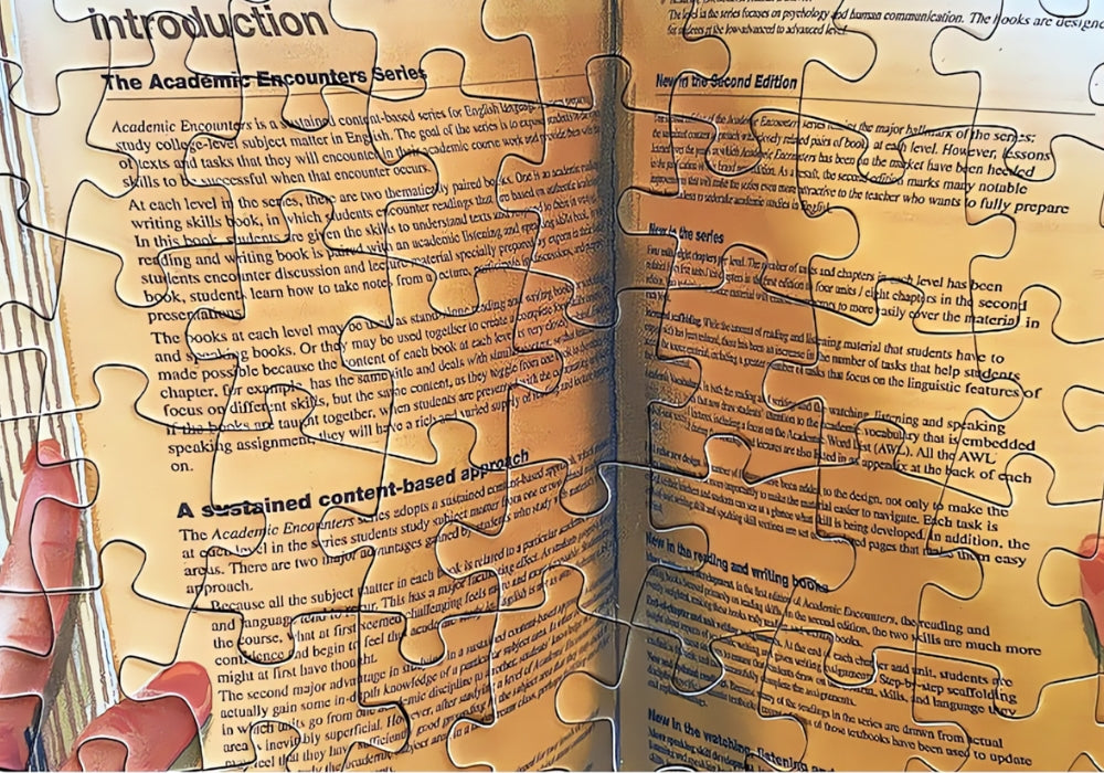 Zoomed-in view of the book in the puzzle showing printed English text and hands holding it