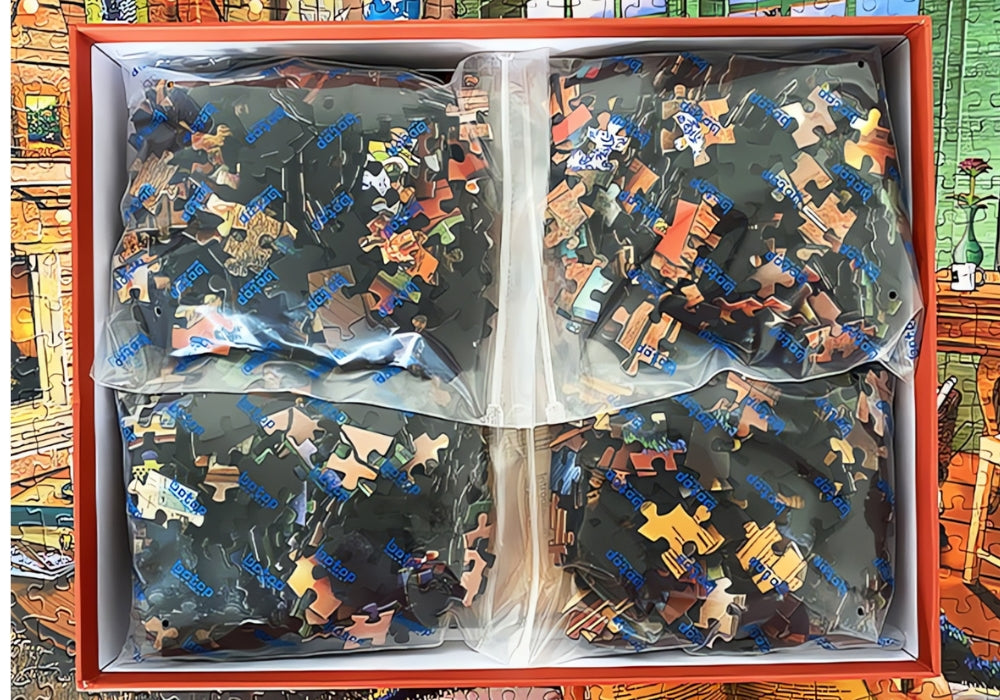 Four sealed bags of puzzle pieces inside the Botop Vacation Home puzzle box