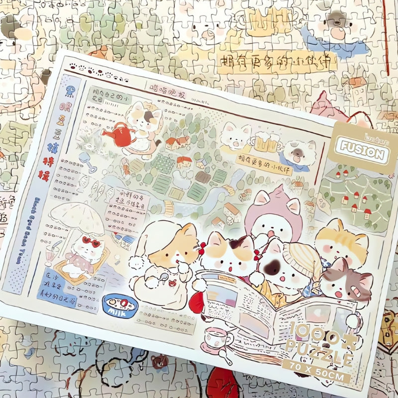 Cat's Newspaper puzzle box sitting on top of finished jigsaw background