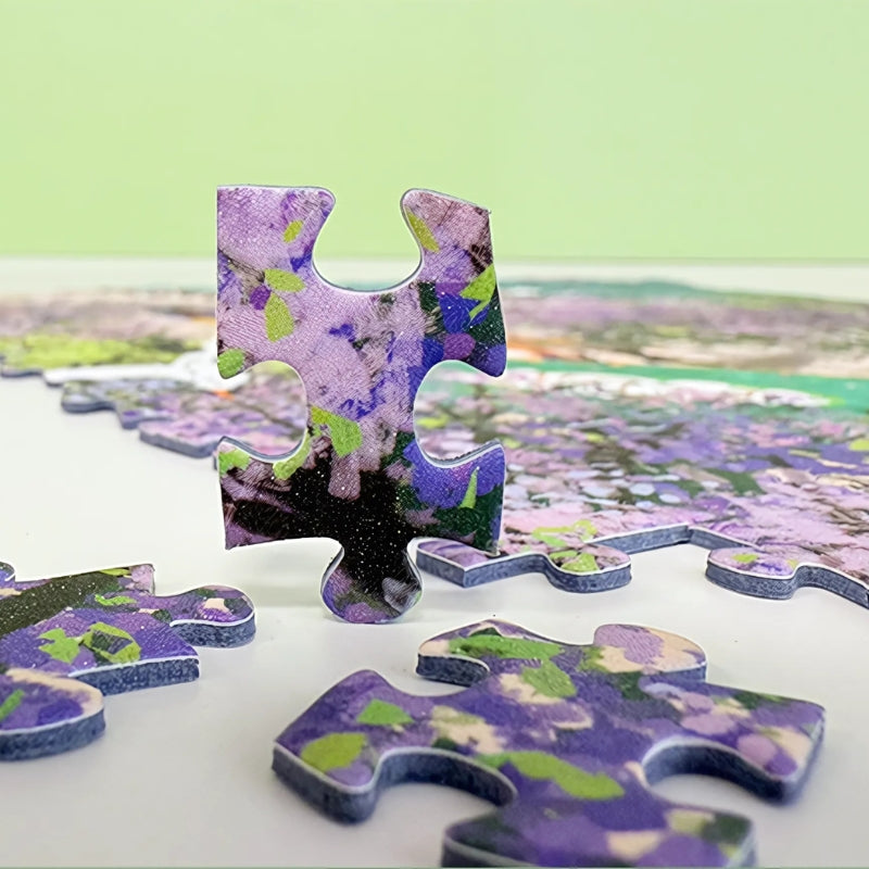 Close-up of a puzzle piece showing vivid purple jacaranda petals and rich print texture.