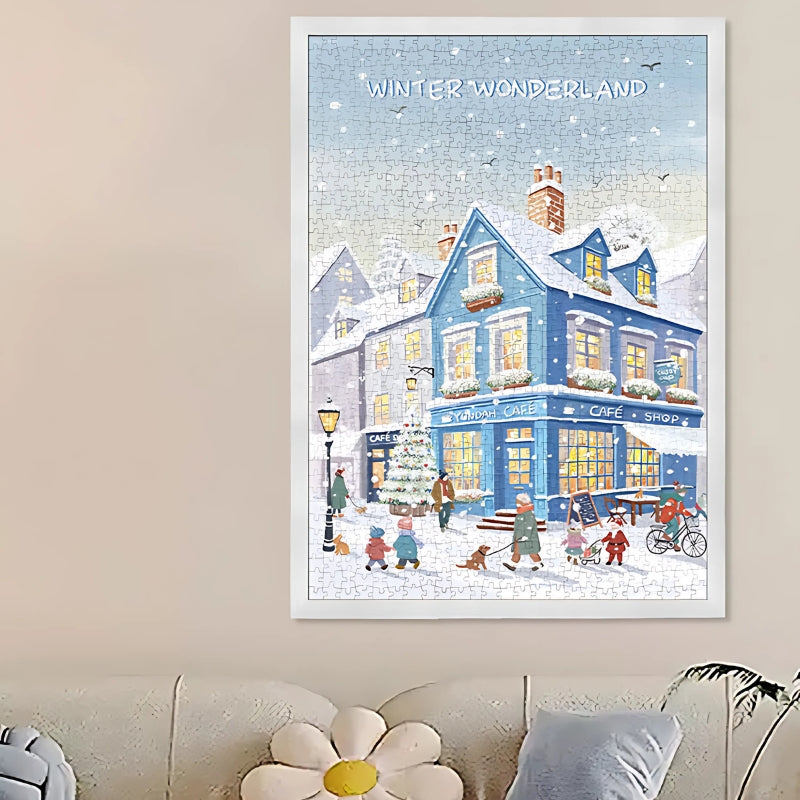 Blue Cafe puzzle fully completed and framed, hung on a wall above a couch for display inspiration.