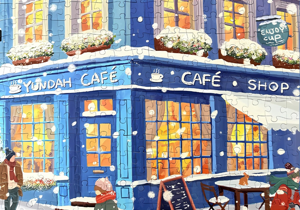Close-up of the Blue Cafe jigsaw puzzle showing detailed artwork of the shopfront and windows.
