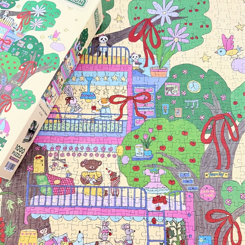 Partially completed Forest Tree House puzzle with the box on top, showing colourful rooms and trees decorated with red bows