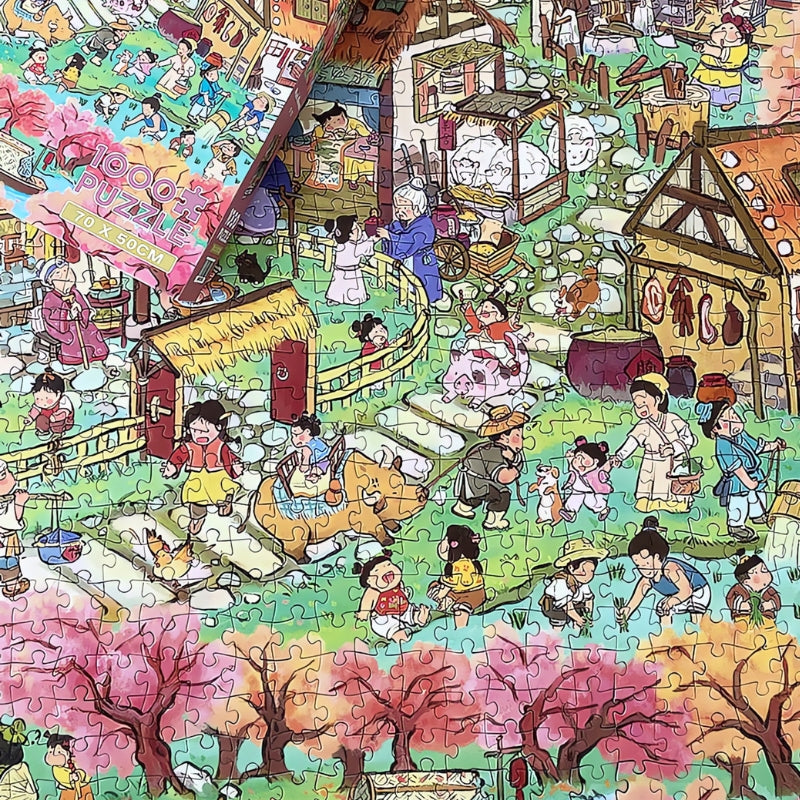 Unboxed Peach Blossom puzzle partially completed on table