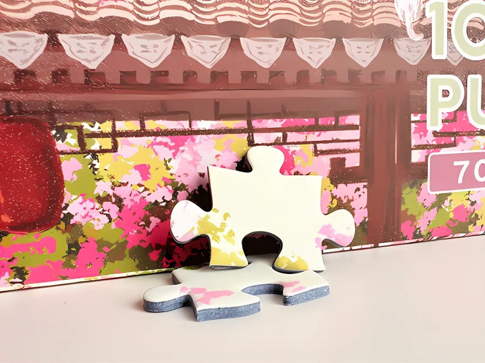 Close-up of two premium puzzle pieces with soft pink and green tones from the Spring on Earth puzzle.