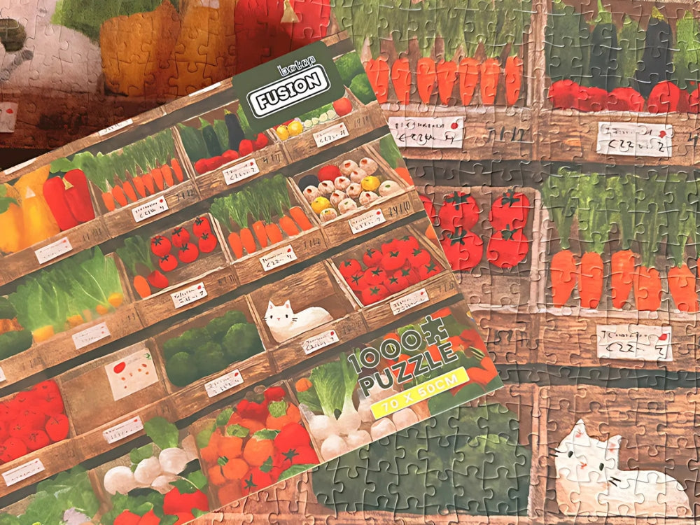 Vegetable Cat puzzle laid out with the box resting on top, showing artwork match and completed detail.
