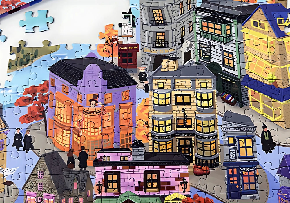 Zoomed-in section of Wizarding World puzzle with colourful fantasy-style shops and characters in black robes