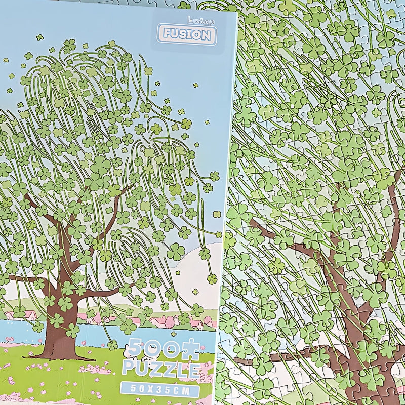 Side angle view of Lucky Tree puzzle box highlighting the pastel artwork and 500 piece count