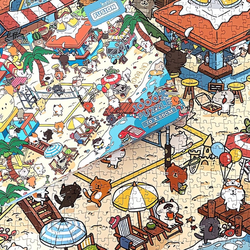 Close-up of Cat Beach puzzle with box on top, showing detailed illustrations of cats playing on the sand.