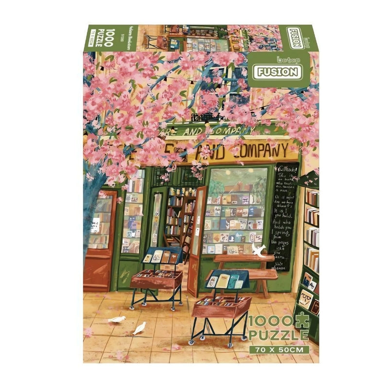 Sakura Bookstore 1000 puzzle box, featuring a quaint green bookstore under cherry blossom trees with book displayed outside.