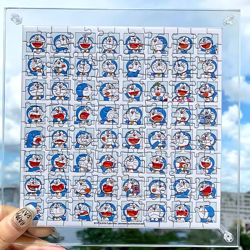 Assembled Doraemon mini puzzle held against the sky, showing a grid of Doraemon facial expressions.