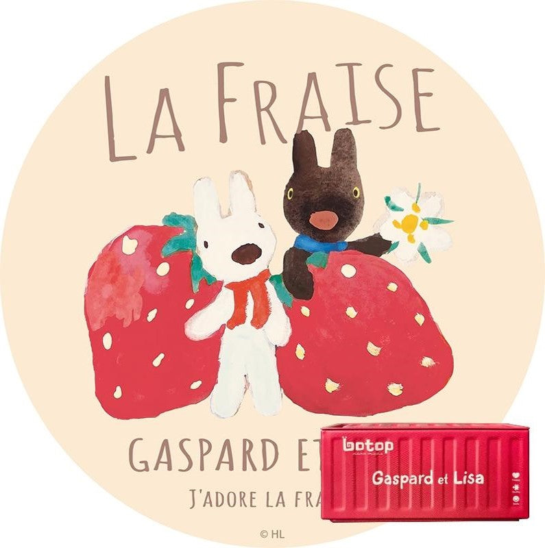 Circular puzzle showing Gaspard and Lisa with oversized strawberries and floral detail, labelled “La Fraise”.