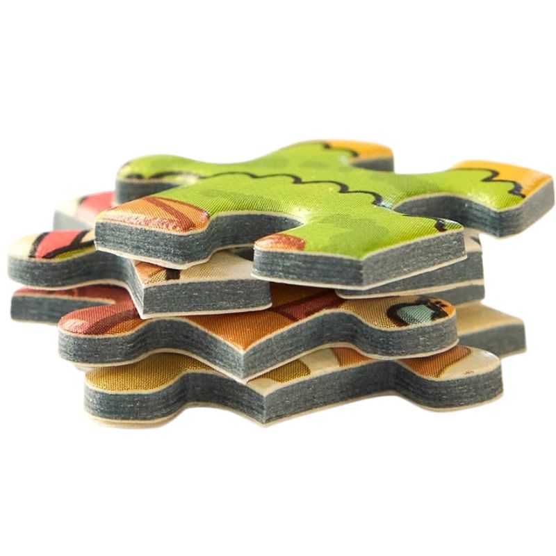 Stack of thick, embossed Keytime Garden Party jigsaw puzzle pieces showing premium quality and vibrant print.
