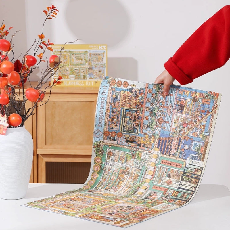 Close-up of Happiness Hut Keytime 1000-piece puzzle being held, showing detailed shop and home scenes.