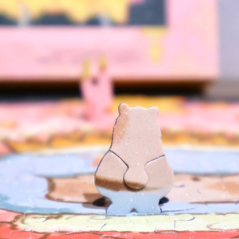 Close-up of the exclusive bear-shaped puzzle piece on top of the completed King of Stars puzzle.