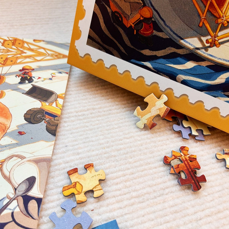 Close-up of Bready Quest puzzle pieces scattered next to the box, highlighting the tactile velvet texture.