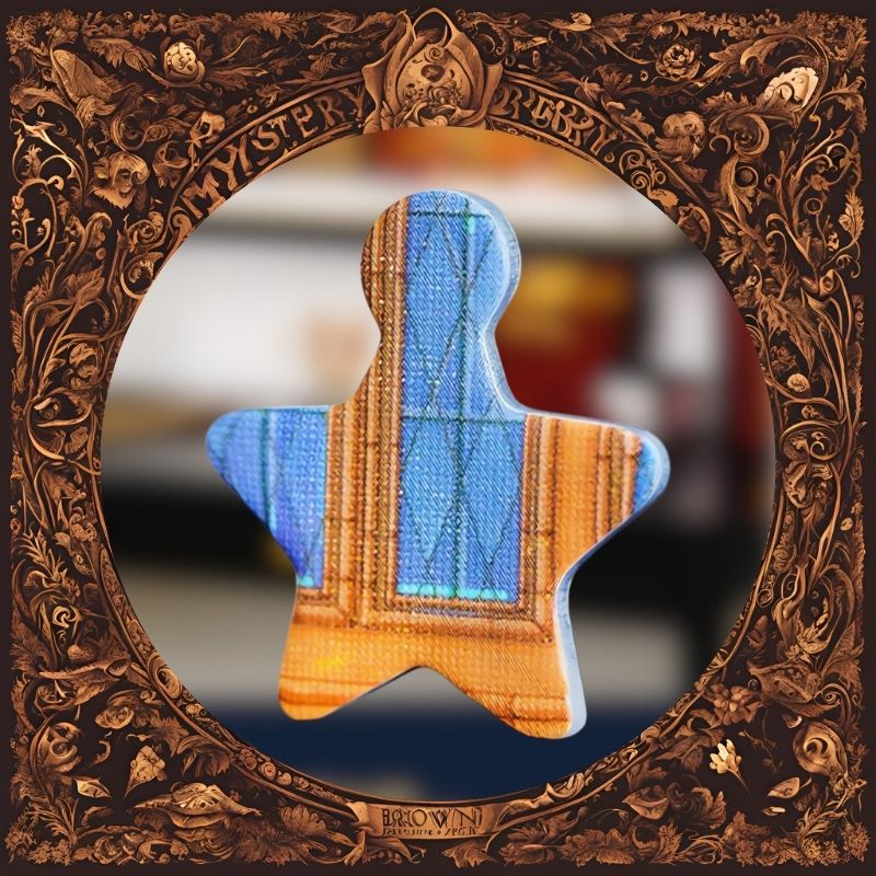 Close-up of a uniquely-shaped puzzle piece painted with a stained-glass window pattern from the Great Hall.