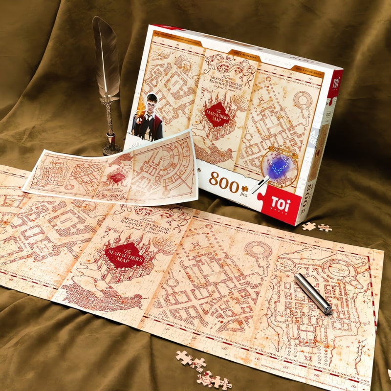 Harry Potter Marauder’s Map puzzle displayed flat with open box, glowing print, and replica map insert.