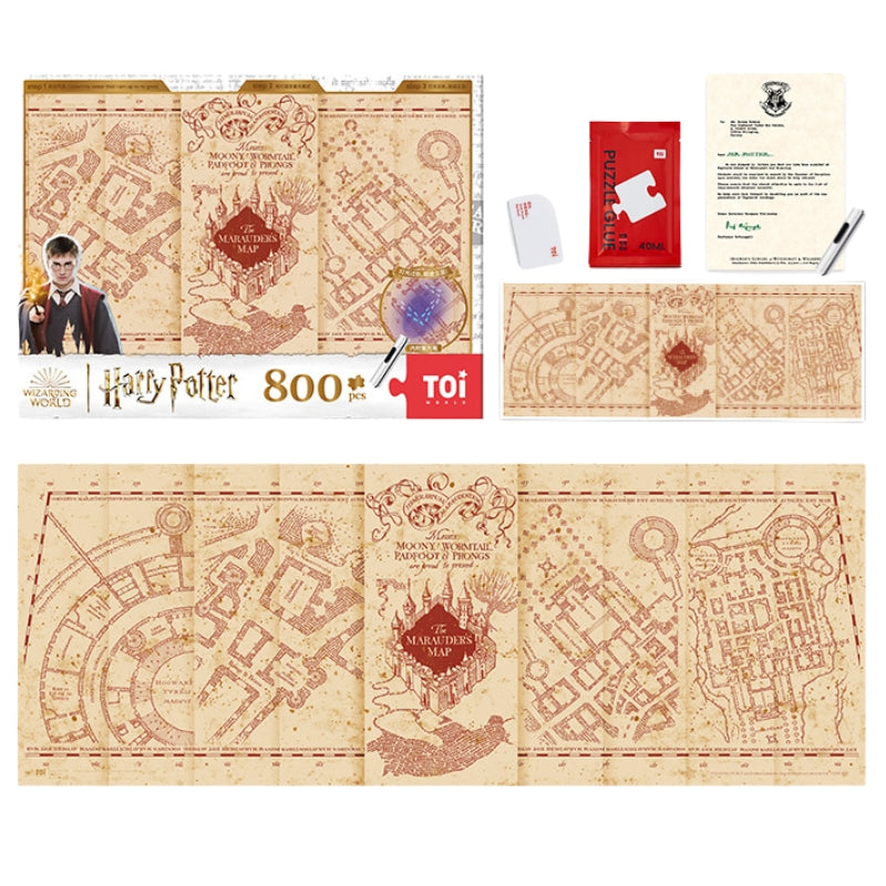 Flat lay of full Marauder’s Map puzzle set with box, completed puzzle, UV torch, glue, scraper, and Hogwarts letter.