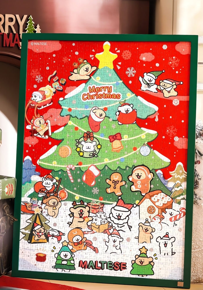 Close-up of completed TOI Christmas puzzle with Maltese puppies, gingerbread cookies, and snowy backdrop