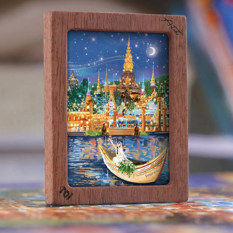 Mini framed artwork of the Moonlit Bazaar puzzle on display.