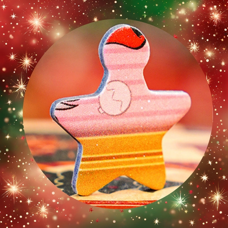 Close-up of star-shaped puzzle piece from Christmas Memoirs with colourful printed detail.
