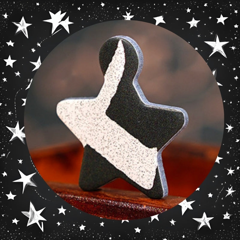 Close-up of a black and white star-shaped puzzle piece from the Coffee Time puzzle.