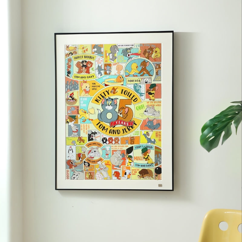 Framed Tom and Jerry Our Memories puzzle hanging on a white wall, styled as wall art.