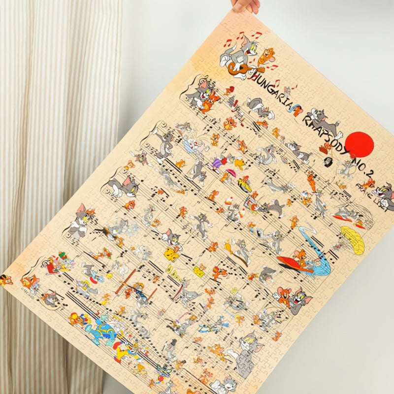 Completed Hungarian Rhapsody No. 2 puzzle held up, showing music-themed scenes with Tom and Jerry.