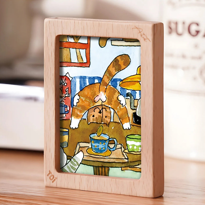 Close-up mini print of a cheeky cat on a café table, included as a bonus artwork.