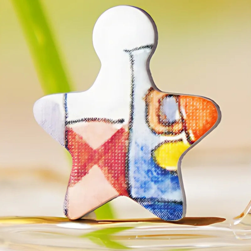 Star-shaped puzzle piece featuring colourful details from the café design.