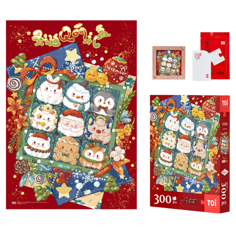 Flat lay of Christmas Cute Gift Box puzzle set showing the completed puzzle, packaging, glue, and wooden display frame.