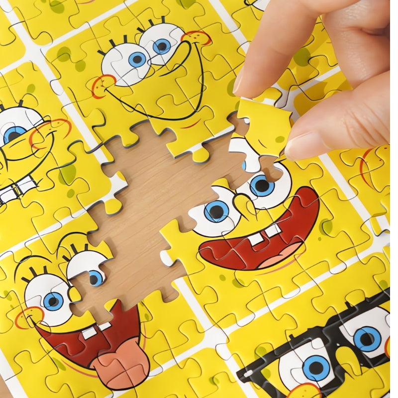 Close-up of hand placing a piece into the SpongeBob Mood Diary puzzle with bright yellow cartoon faces