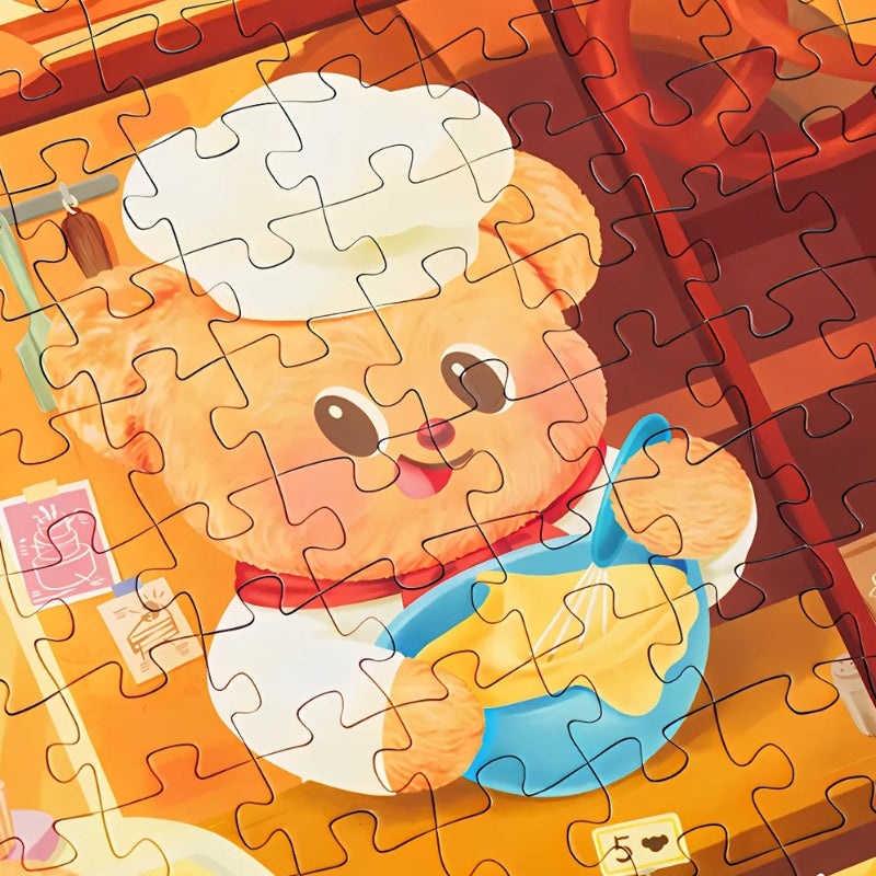 Zoomed-in view of a puzzle section showing a cute bear baker stirring batter in Butterbear – Dessert Paradise.