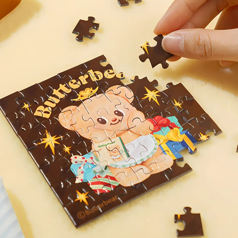 Person assembling the Star Wish Butterbear mini puzzle.