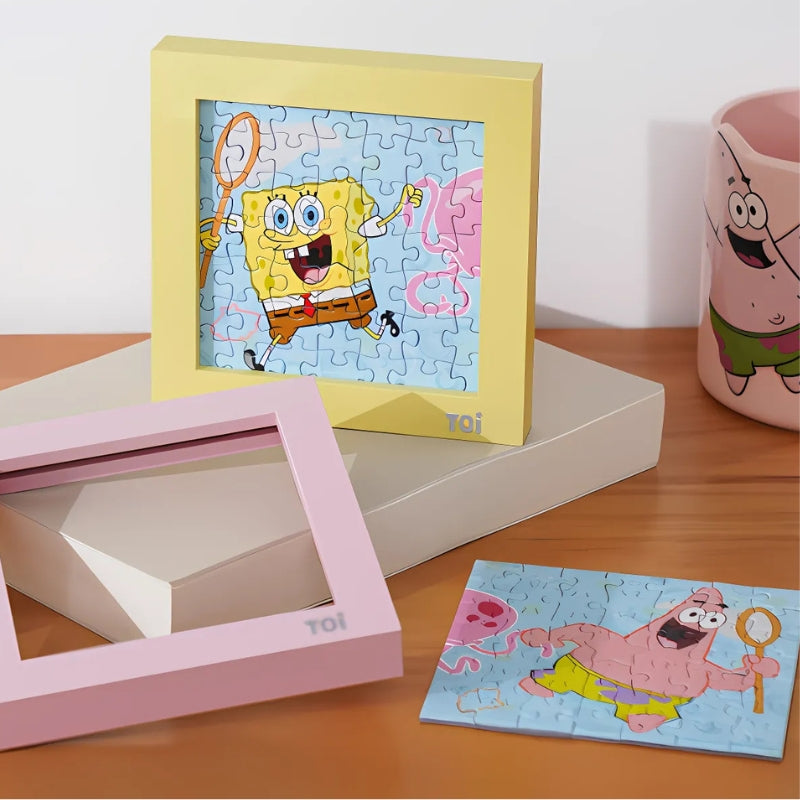 Puzzle frame with completed SpongeBob puzzle and disassembled Patrick puzzle nearby.