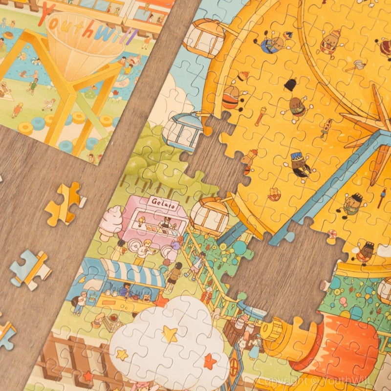 Puzzle detail showing coffee rides and biscuit Ferris wheel with product box.