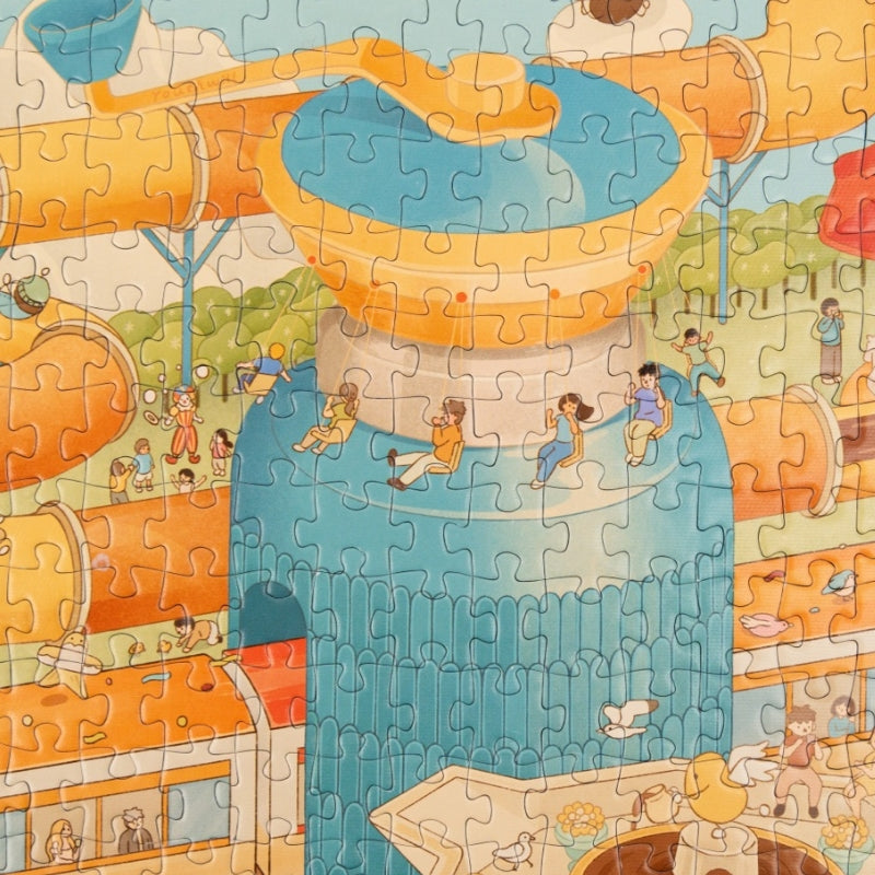 Close-up of puzzle section featuring coffee pot water slide and theme park visitors.