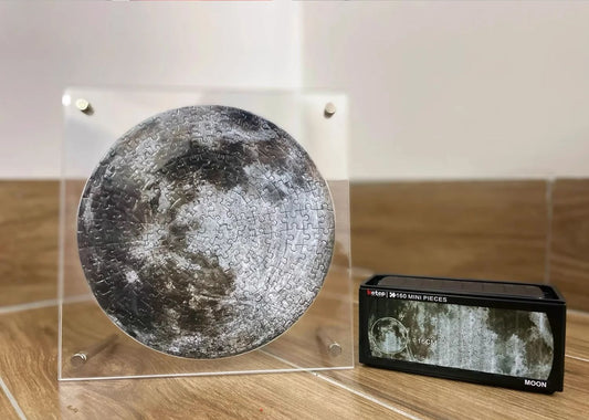 Round moon puzzle in acrylic frame shown beside matching Botop puzzle box.