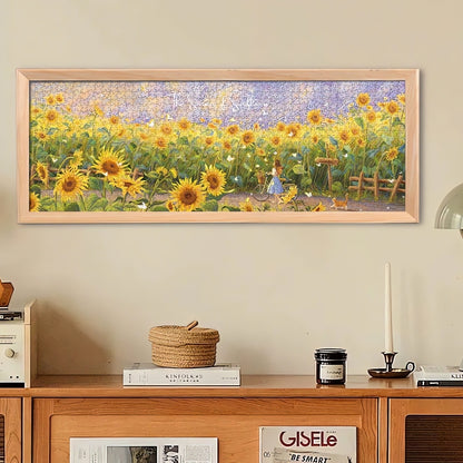 Completed Summer of Sunflowers puzzle in frame on a wooden cabinet.