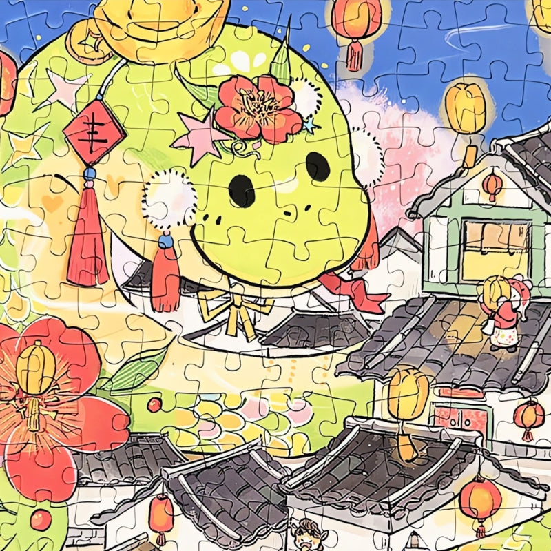 Close-up of the green cartoon dragon character in the Draw Snake puzzle, decorated with flowers and lanterns